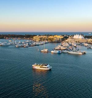 an aerial view of a harbor with boats in the water