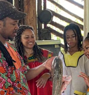 a group of people standing next to a man