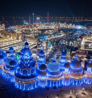 a building decorated in blue lights at night