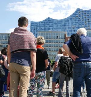 a group of people standing in front of a building