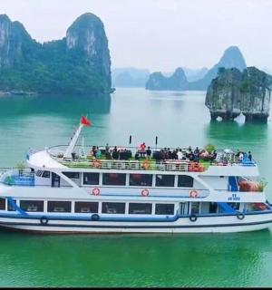 a boat in the water with a group of people on it