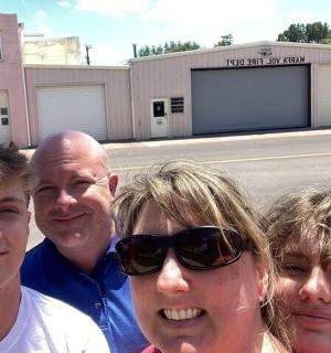 a group of people standing in front of a building