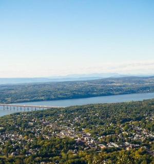 an aerial view of a bridge over a body of water