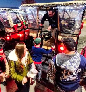 a group of people standing around a food truck