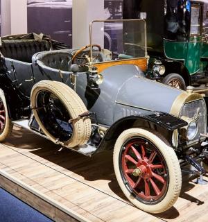 an old car on display at a museum