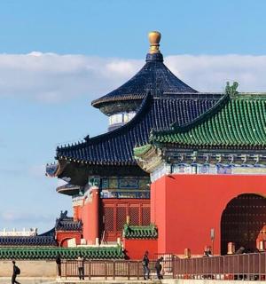 a large red building with a green roof