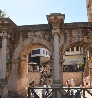 a group of people walking around a building