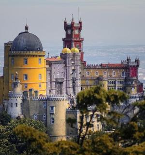 a castle sitting on top of a mountain