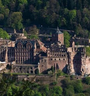 an old castle sitting on top of a hill