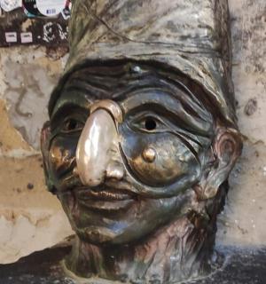 a statue of a person wearing a hat