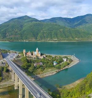 an aerial view of a bridge over a body of water