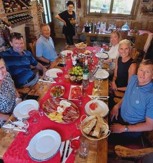 a group of people sitting at a table in a restaurant