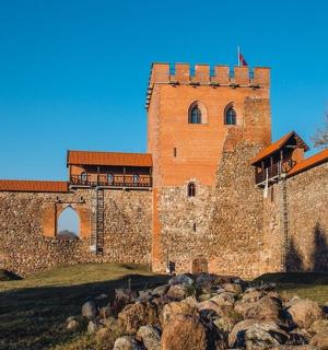 a large brick building with a tower on top