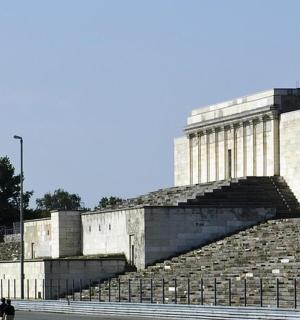 a building with some people walking in front of it