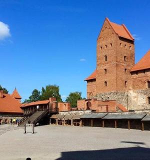 a large brick building with a tall tower