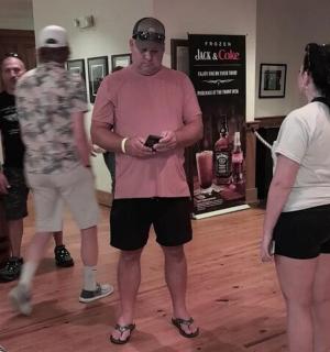 a group of people standing in a room playing a video game