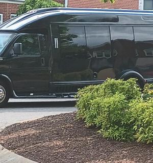 a black van parked on the side of a street