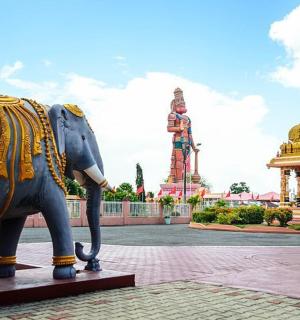 a statue of an elephant in front of a building
