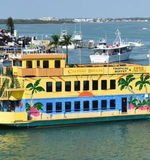 a large yellow and blue boat in the water
