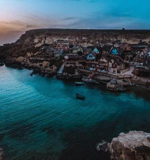 an aerial view of a small town on the ocean