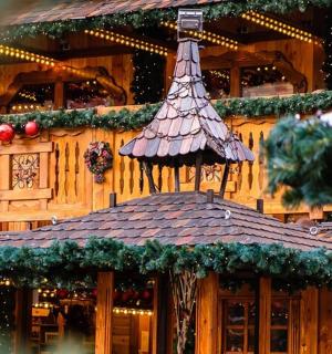 a building with a christmas decoration on the top of it