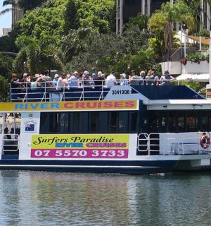 a tour boat with people on it on the water