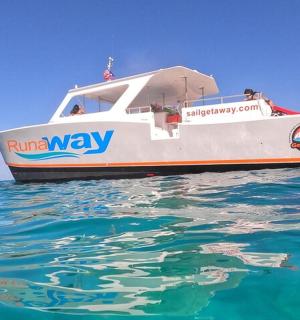 a boat in the water with people on it