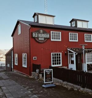 a red building with a sign on the side of it