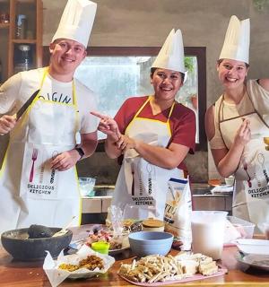a group of three chefs standing in a kitchen