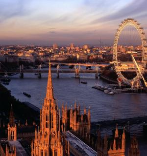 a view of the london eye and big ben and the river thames
