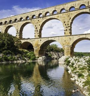 a bridge over a river with many arches on it