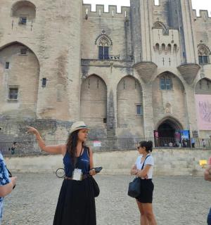 a group of people standing in front of a castle