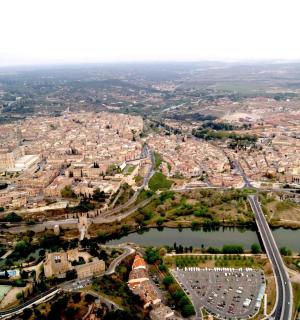 an aerial view of a city with a river