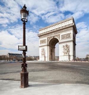 a street light in front of the eiffel tower