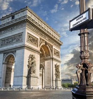 a building with a sign in front of a pole