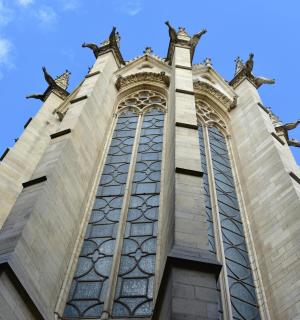 a tall building with large windows on top of it