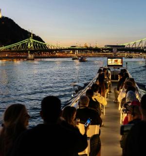 a group of people on a boat in the water