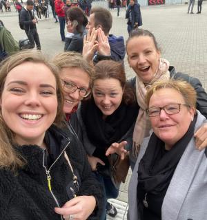 a group of people are posing for a picture