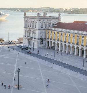 a cruise ship in the water next to a city