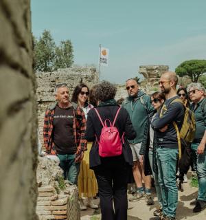 a group of people walking through the ruins