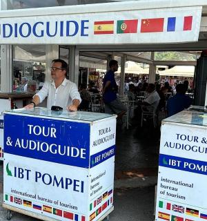 a man standing in front of two boxes