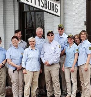 a group of people standing in front of a building