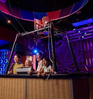a group of people on a stage with a laptop