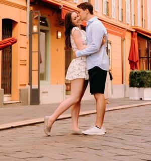 a man and a woman walking down a street