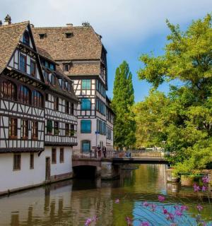 a group of buildings next to a river