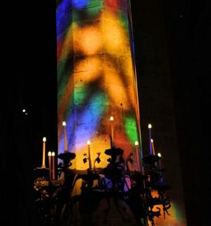 a brightly lit building with a rainbow colored