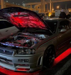 a car with its hood open with its engine