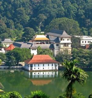 a group of buildings sitting on top of a lake