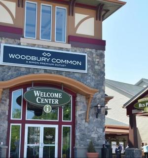 a welcome center sign in front of a building