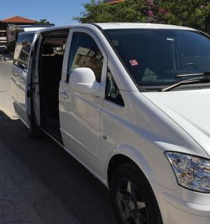 a white van parked on a street with its door open